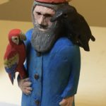 Noah with raven and parrot
